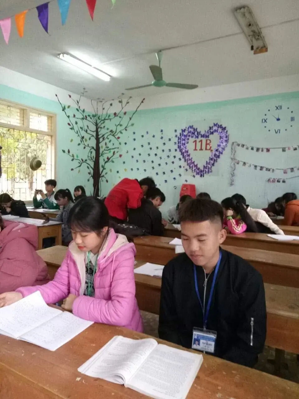 Phan Văn Khải seated in his classroom